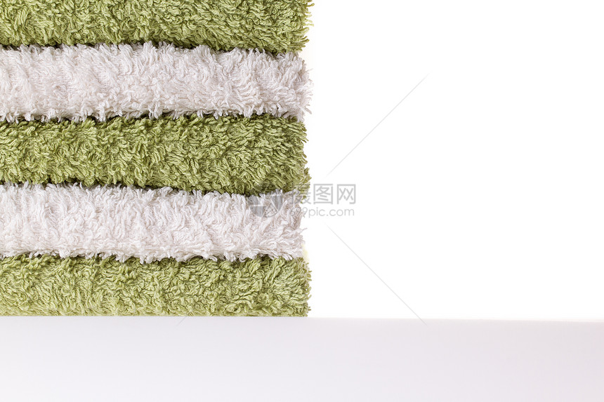 绿毛巾和白毛巾材料羊毛乐队棉布浴室纤维治疗纺织品酒店回旋图片