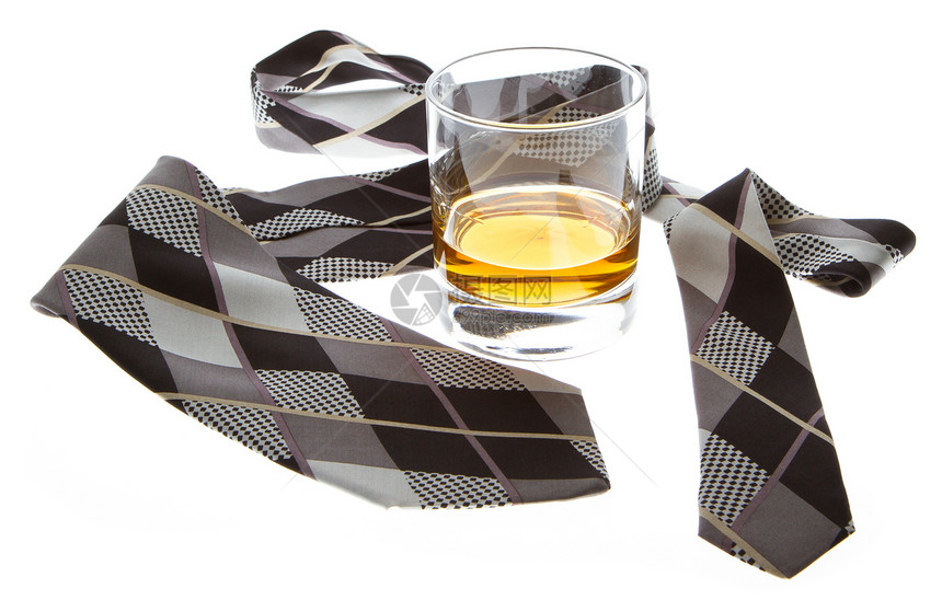 一杯威士忌和一条领带剂量金子人士软木商业玻璃商务液体享受桌子图片