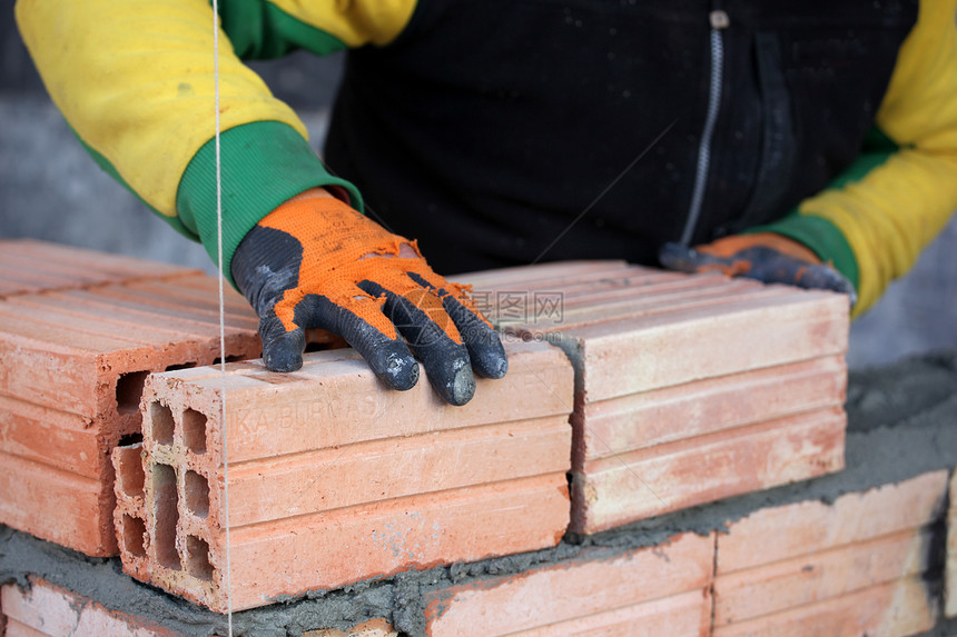砖层瓦工承包商劳动建筑男人建设者橙子房子建造脚手架图片