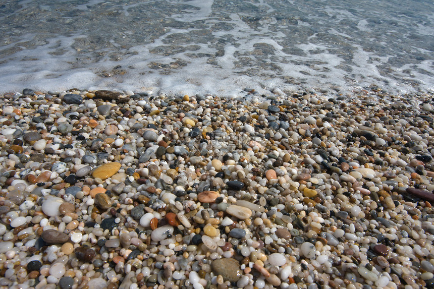 海滩上的小石头卵石粮食碎石岩石海岸热带图片