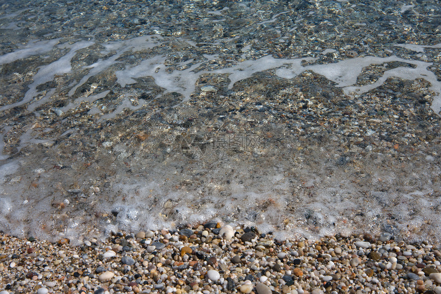 海滩上的小石头岩石热带海岸碎石粮食卵石图片