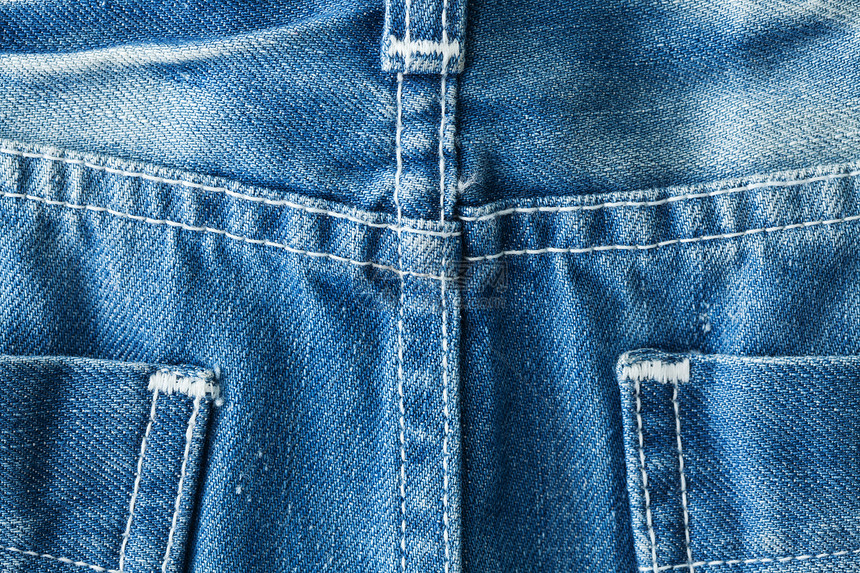 蓝牛仔裤口袋式特贴纤维面料摄影材料棉布裤子衣服纺织品口袋接缝图片