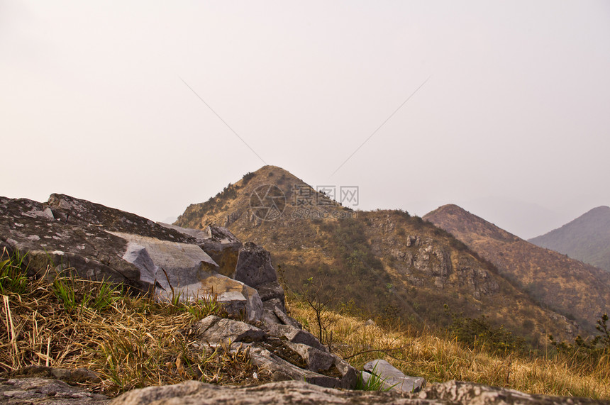 中国广东海脊高山顶端的中国山顶首脑垂直度远景布雷爬坡地质学山麓悬崖高地图片