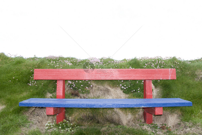 新油漆的红色长椅和蓝色蓝长椅图片