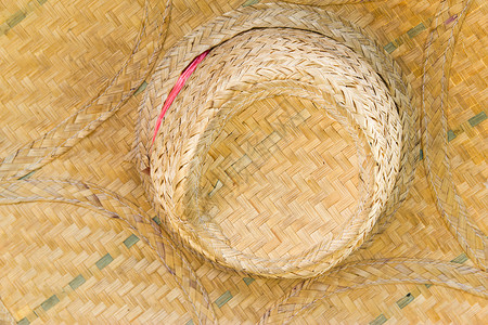 草帽编织干树叶树叶上的树帽 自然的物体女士工艺柳条艺术国家农场手工篮子女孩文化背景