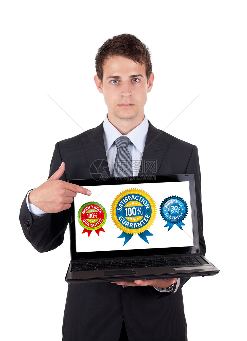 商务人士指着一台笔记本电脑展示男人人士公司屏幕生意人技术管理人员商业白色图片