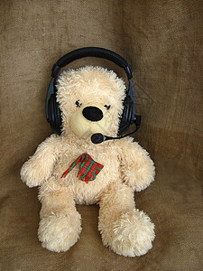 广告熊素材耳机中的玩具熊背景