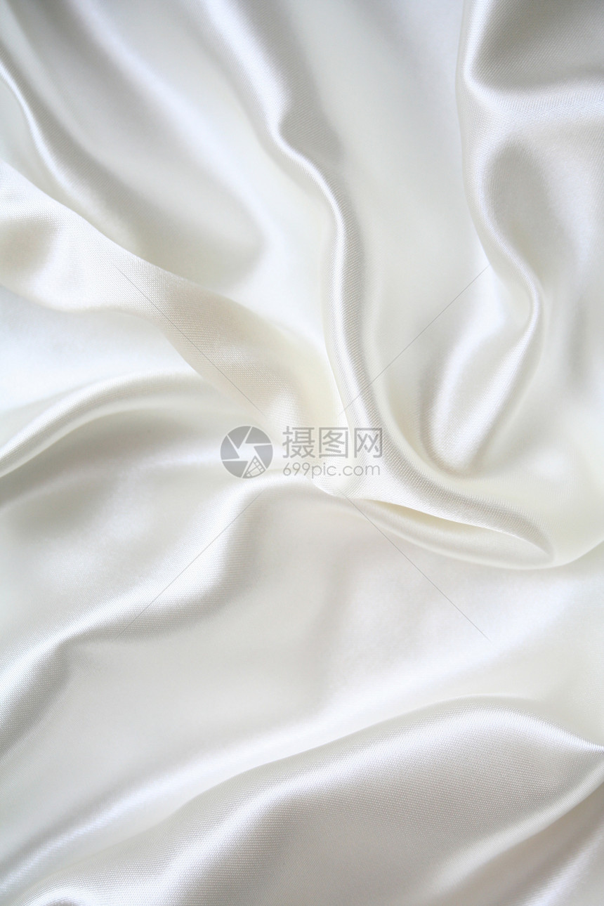 平滑优雅的白色丝绸作为背景布料感性投标婚礼反光新娘银色海浪涟漪纺织品图片
