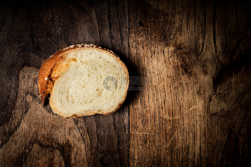 在木头上切片全美芝麻芝麻面包种子生食纤维小麦美食面包师饮食粮食食物乡村图片