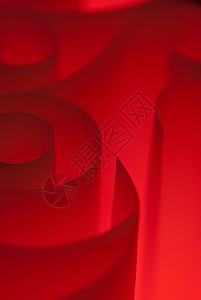 红色抽象床单笔记办公室暖色卷曲宏观漩涡材料光圈螺旋背景图片