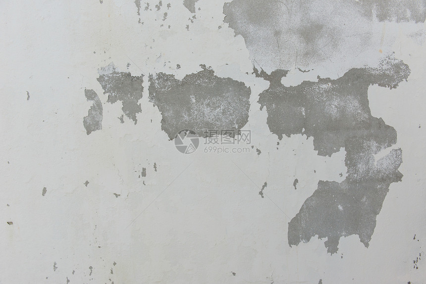 白漆水泥墙上的碎裂板航班蓝色帆布航空石头天空材料土地地面商业图片
