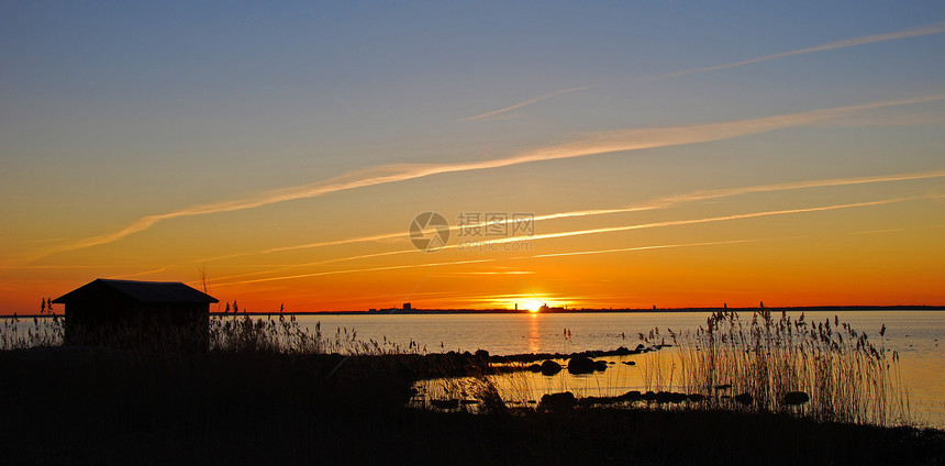 日落太阳橙子蓝色环境农村阳光海岸线地平线场景辉光图片