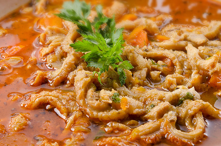 波兰传统牛肚汤餐厅薄片养牛盘子香菜猪肉饮食美味食物蔬菜背景图片