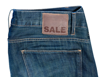 配有售卖标志的Jeans口袋折扣标签出口销售裤子徽章牛仔布牛仔裤织物背景图片