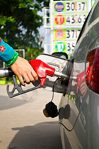 在汽车中添加燃料车站煤油红色情况喷嘴柴油机汽油石油运输车辆背景图片