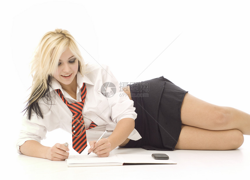 做家庭作业的漂亮少女白色女学生工作衬衫冒充女性女孩青年金发学生图片