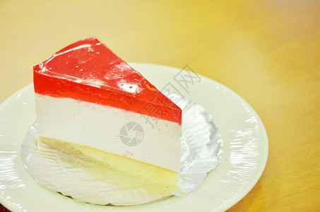 草莓奶酪蛋糕蛋糕甜点红色糖果桌子咖啡馆背景图片