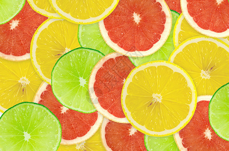 柑橘切片摘要背景 特写 工作室照片肉质摄影黄色橙子红色绿色柠檬宏观活力圆圈背景图片