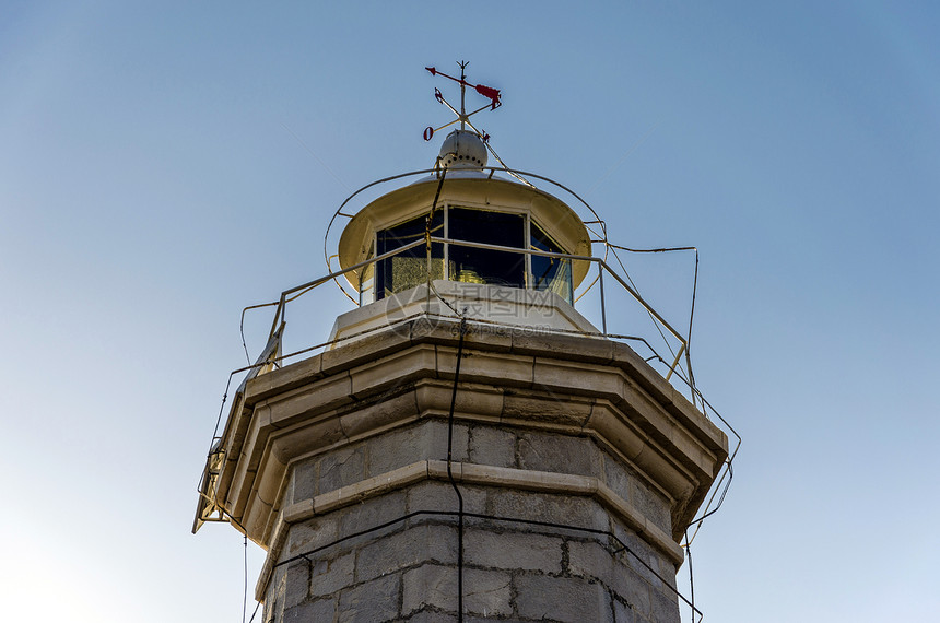 灯塔之顶安全海岸线石工石头纪念碑岩石海岸房子航海太阳图片