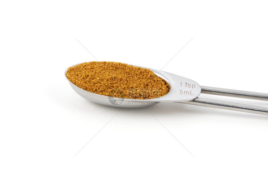 在金属茶匙中测得的咖喱粉粉图片