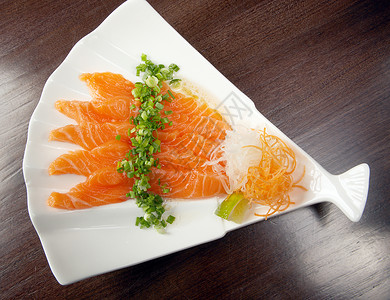 沙门塞西米拼盘鱼片盘子海鲜熏制香料鲷鱼食物背景图片