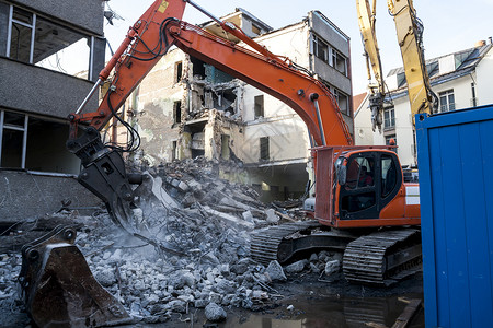拆除旧建筑挖掘机推土机工具工业损害工作断路器拆卸房子碎片背景