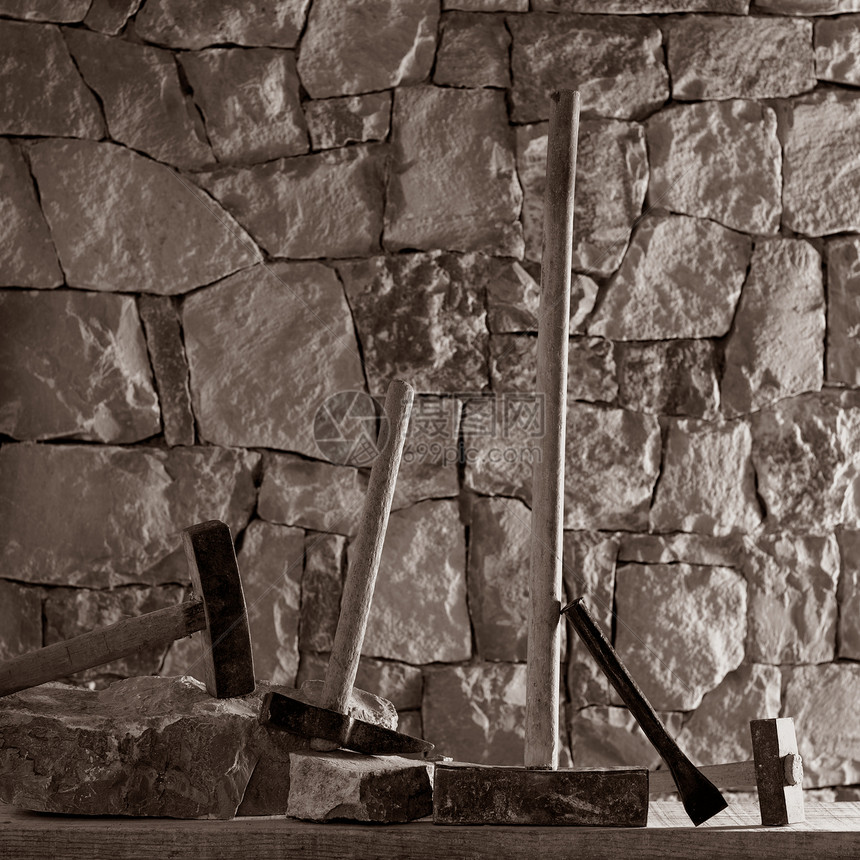 石匠泥瓦工的锤子工具石方建造工作风化建筑学石墙建筑风格石工岩石图片