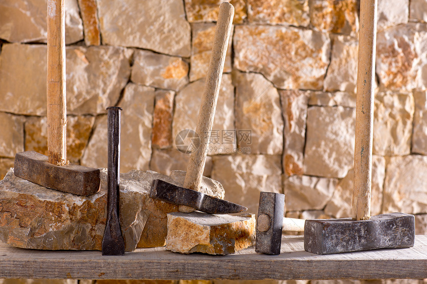 石匠泥瓦工的锤子工具房子栅栏石方材料建造石墙岩石建筑学石头石工图片