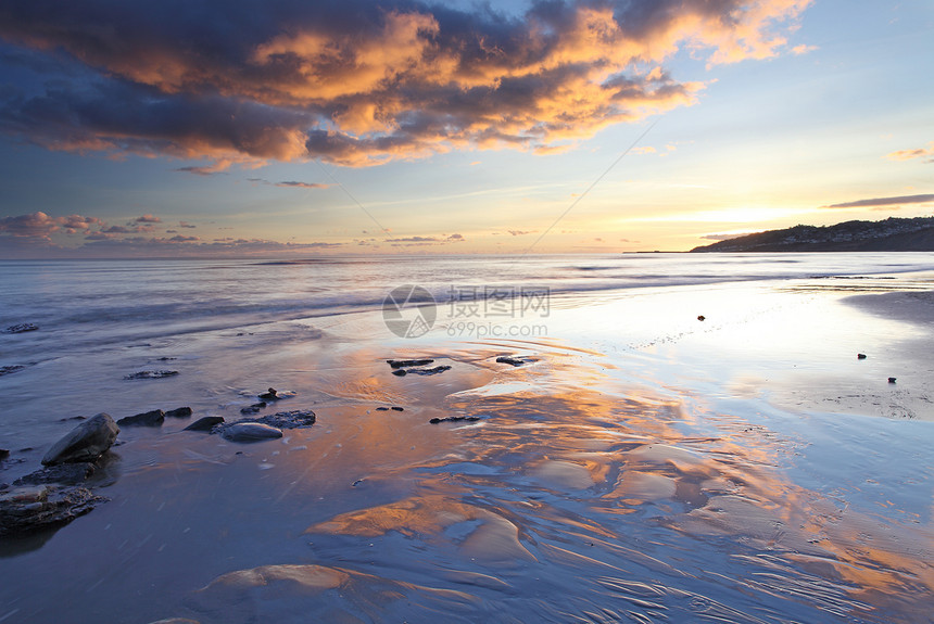 日落在Lyme Regis上空风景地平线旅行英语海岸线旅游海岸化石海洋海滩图片