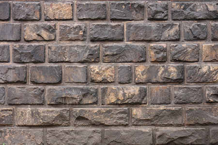 墙壁纹理石头水泥棕色矩形石匠建筑城市斑点砖块墙纸背景图片