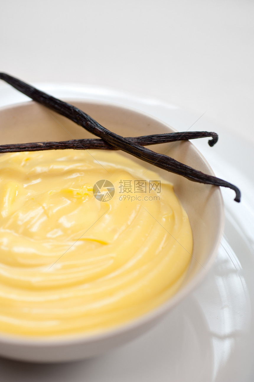 配有种子棒的香草果奶油餐厅黄色糕点奶制品食物宏观甜点香草牛奶白色图片