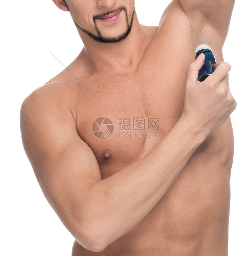 英俊的年轻人施香水瓶子化妆品男生男性卫生成人浴室护理胡须小伙子图片