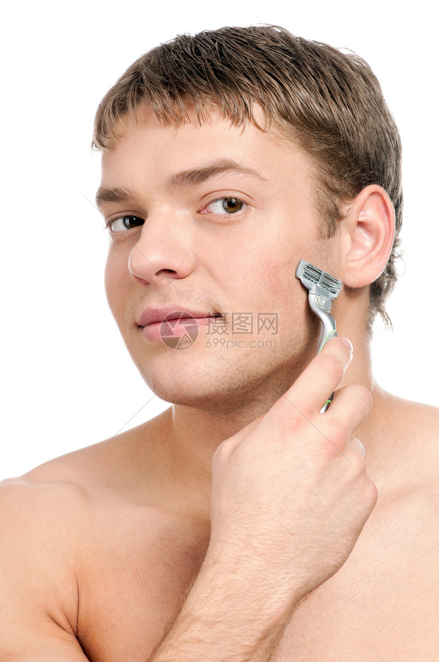 一个年轻英俊男子刮胡子的肖像卫生男性成人牙齿护理粉碎皮肤洗澡刮胡子青年图片