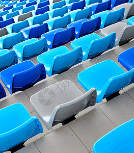 体育场的蓝色座位运动长椅塑料空白场地会场民众观众椅子看台背景图片