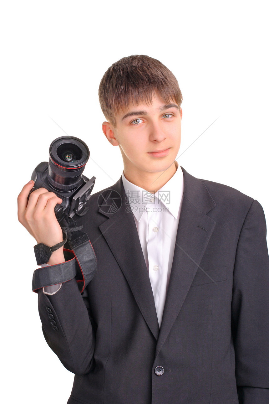 拥有照相机的青少年专注享受衬衫摄影师带子记者头发工作室相机青年图片