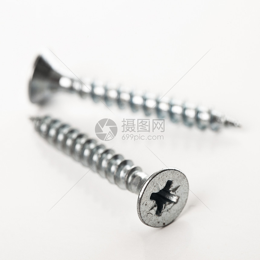 白色背景的银钉钉工业工具乐器指甲维修灰色金属团体螺柱宏观图片