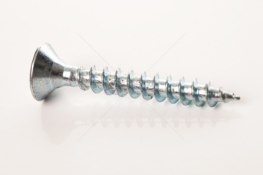 白底的银钉维修乐器工作白色螺柱硬件指甲工业宏观工具图片