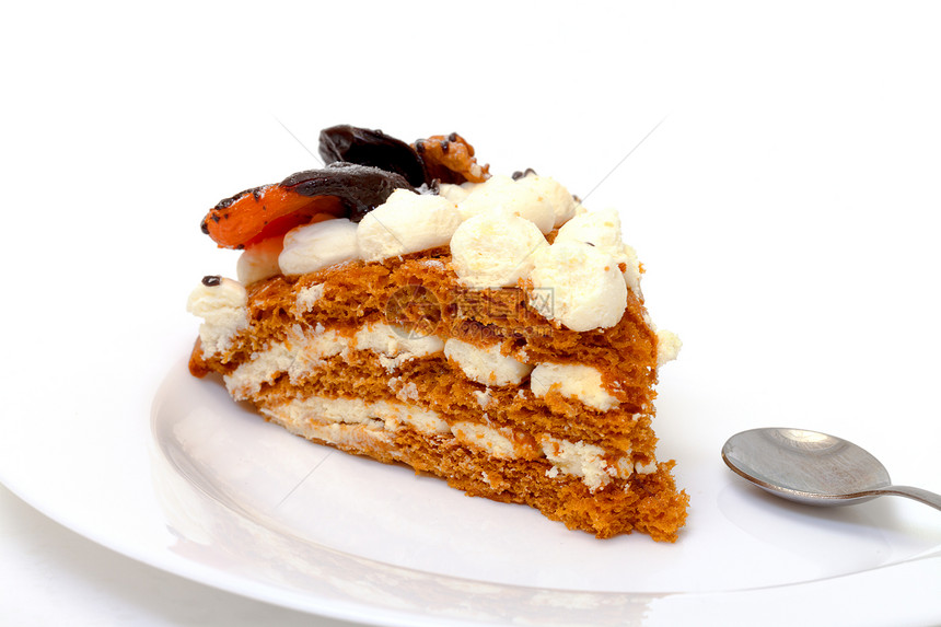 盘子上一块甜蛋糕奶油棕色食物馅饼白色勺子糕点甜点美食图片