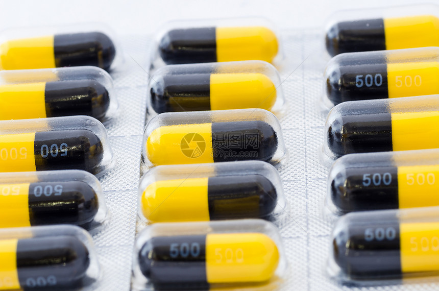 黑色和黄色胶囊药品剂量制药疾病团体宏观药店图片