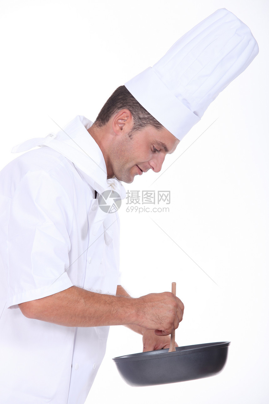 做饭的厨师专家男人食物油炸餐厅白色平底锅职业烹饪勺子图片