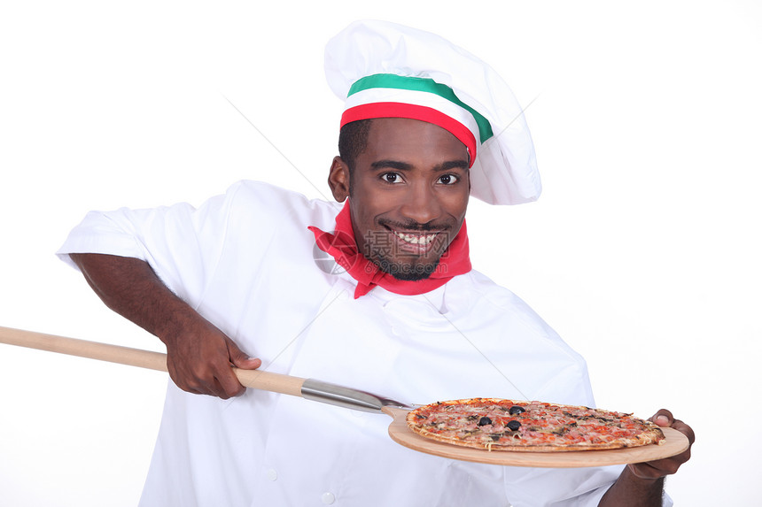 意大利厨师 在木皮上披萨图片