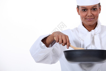 女性烹饪 用高档煎锅和木勺背景图片