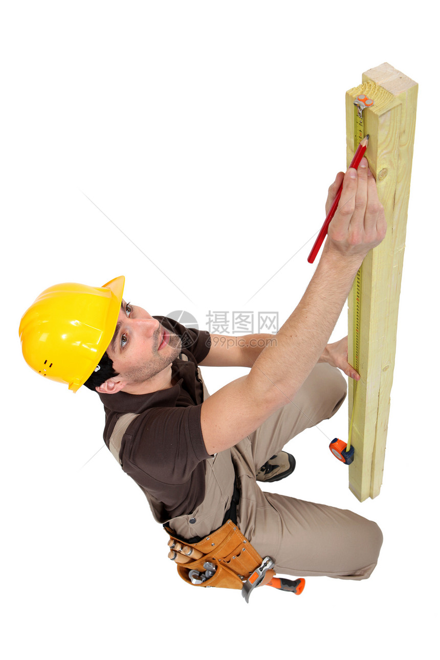 进行测量的木匠领班工具铅笔建设者承包商男性熟练工维修工人劳动者图片