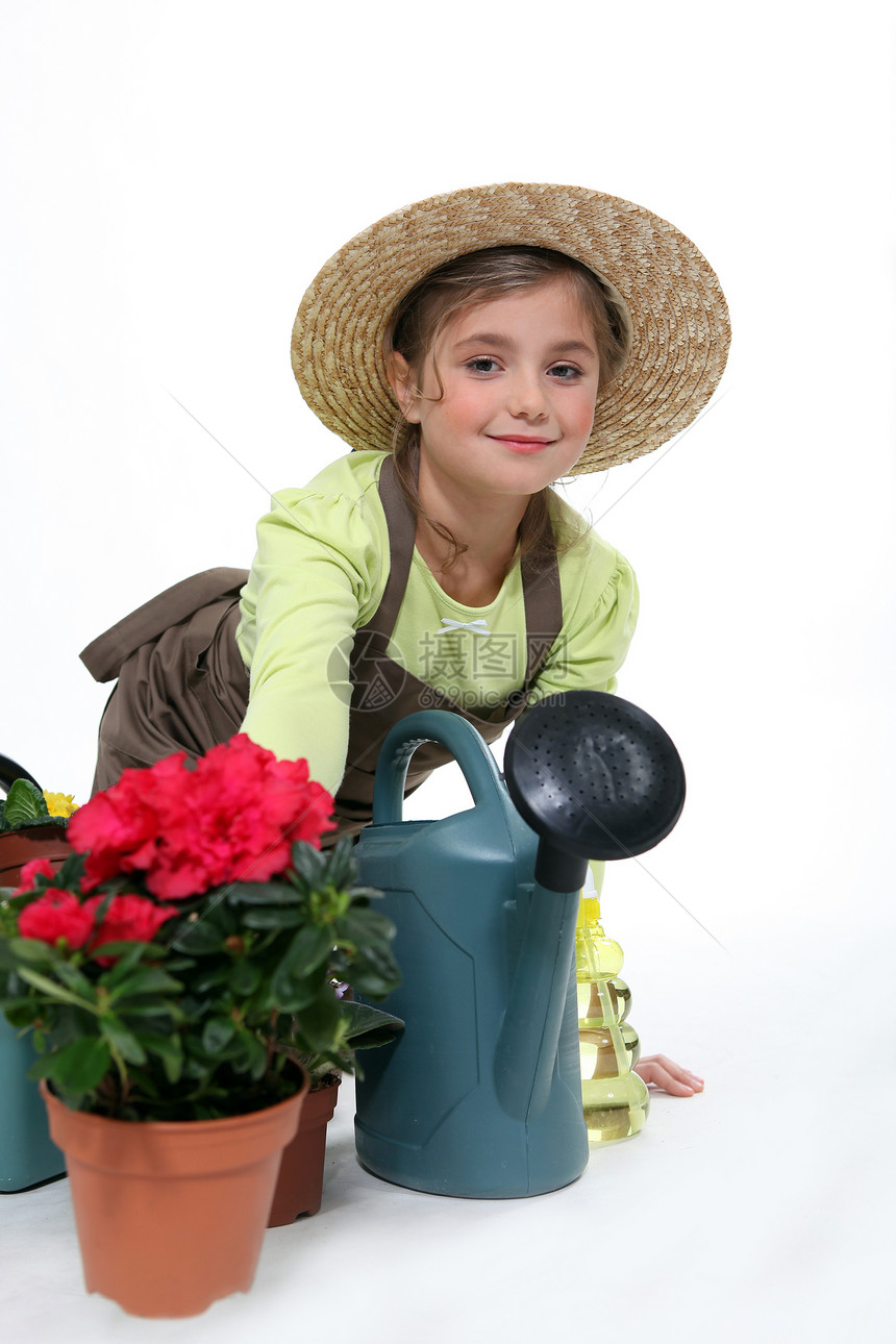 年轻的园艺青年女孩幸福闲暇孩子享受晴天水罐爱好花园太阳图片