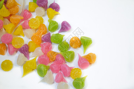 Aalaw糖果蜜饯粉色绿色紫色彩虹甜点黄色橙子白色背景图片
