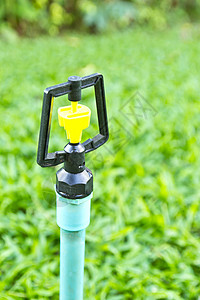 吹尘器特写泉水器绿色射线光线花园喷出背景