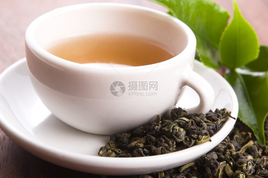 茶杯中含酸树叶的绿茶棕色早餐金子草本植物植物饮食宏观绿色叶子图片