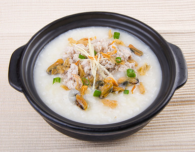 鸡粥传统中国猪肉粥炒饭 在粘土锅中使用草药水平早餐午餐美食烹饪白色稀饭文化蔬菜背景