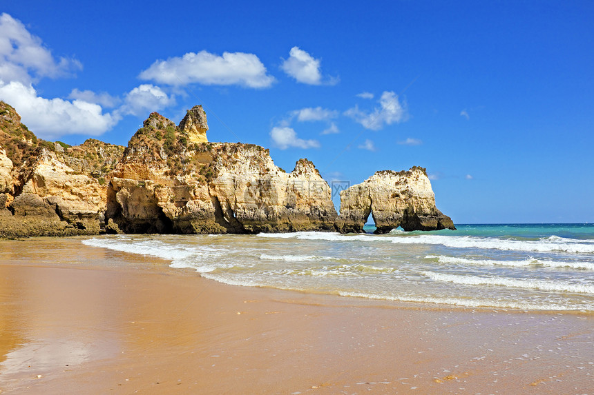 葡萄牙阿尔加尔夫省Alvor的岩石波浪石头海滩海洋图片