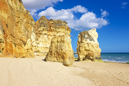 葡萄牙阿尔加夫的普拉亚达罗查石头海滩海洋背景